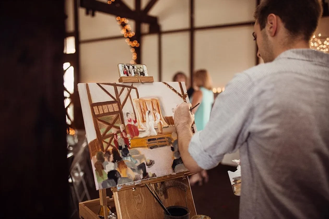 Artist painting live at a wedding reception